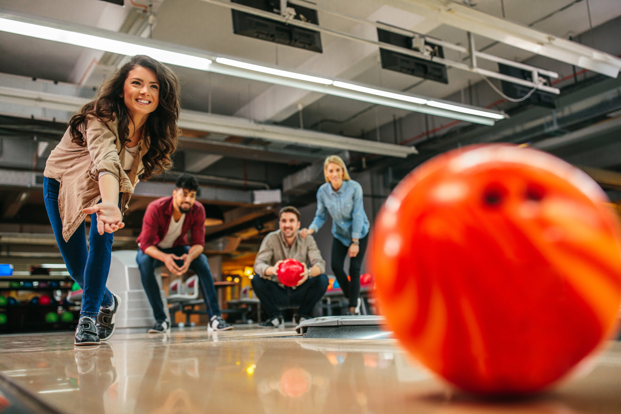 Kids enjoying bowling, laser tag or arcade activities